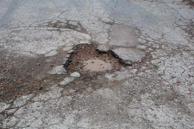 Potholes impact Rapid City as they do every community.  Residents can call the Pothole Hotline at 394-4152 to report a pothole and City crews work to fix the area the same day or next day.