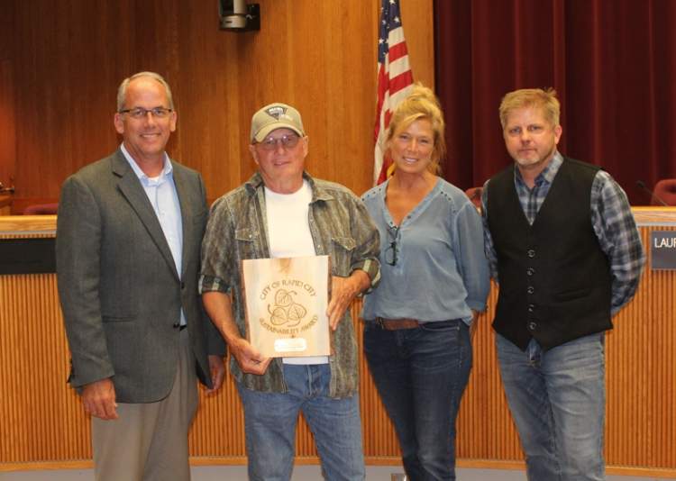 Wild Idea Buffalo Company received the City's Sustainability Award at the July 17 Council meeting.  From left: Mayor Steve Allender, Dan O'Brien, Jill O'Brien, Eirik Heikes of the Sustainability Committee.