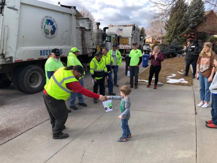 Maddux Reed loves to watch the garbage man and his big truck visit his house each Friday.  Maddux takes the family trash to the curb and makes sure the neighbors have their trash out as well.  He watches the garbage truck and his buddy Bob drive by each Friday.  Maddux celebrated his third birthday today (February 18) with a trash bash theme party.  Solid waste drivers stopped by, honking their horns and singing him happy birthday.