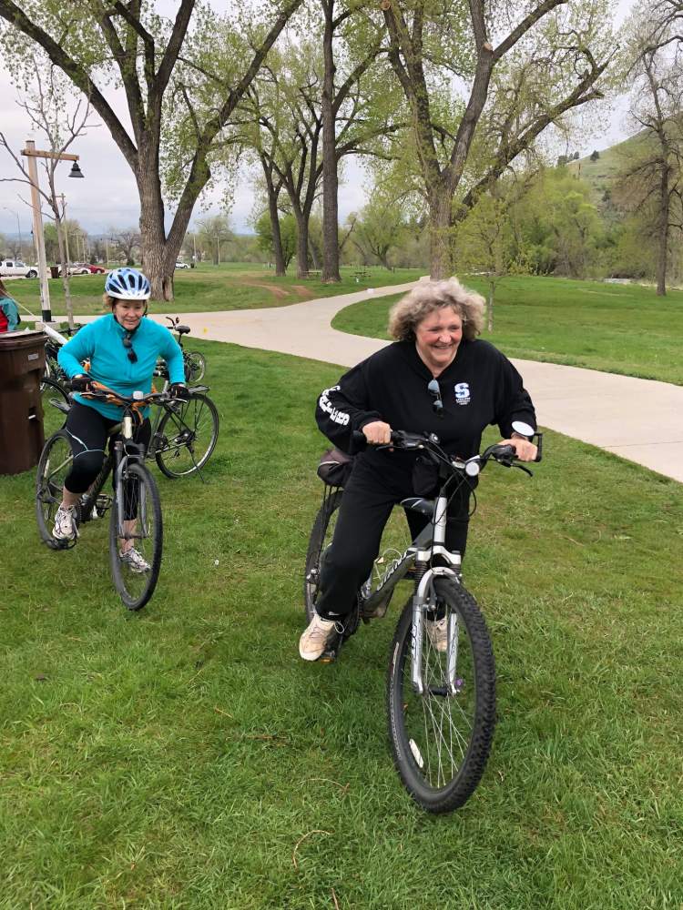 Bicyclists, including former Council member Becky Drury, stopping by the Parks/Rec Bike For Bacon event in 2019. The event is one of several the City uses to promote biking to work and school.  The City is under consideration for designation as a bicycle-friendly community.