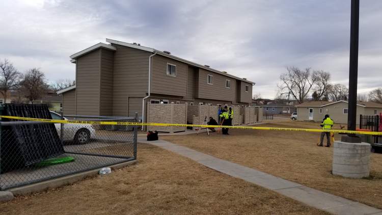 Police investigating homicide at 313 E. Adams Street, suspect in custody