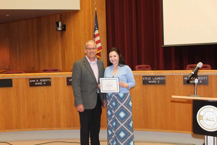 Mayor Steve Allender and Amber Oldfield.  Oldfield was recognized at the April 17 City Council meeting as the City's first Hidden Hero of the Month for her work as a veteran caregiver and caregiver advocate.