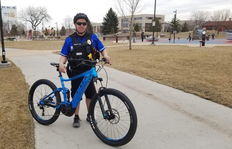 Officer Anthony Picket Pin with one of the RCPD's new electric bikes