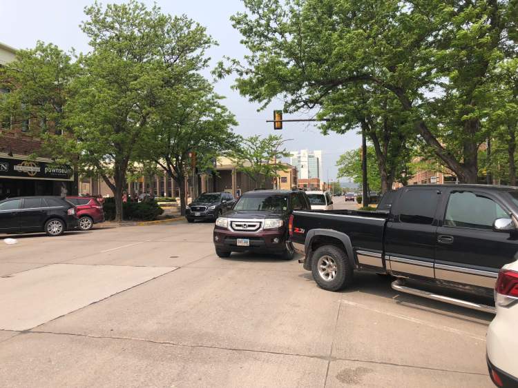 City parking enforcement officers have issued dozens of citations during the first half of the year for vehicles obstructing traffic, extending into the traffic lane.