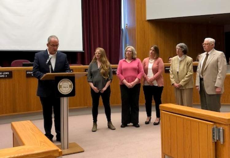 Mayor Steve Allender and officials of local volunteer organizations gather for a mayoral proclamation designating April 15-21 as National Volunteer Week in Rapid City.