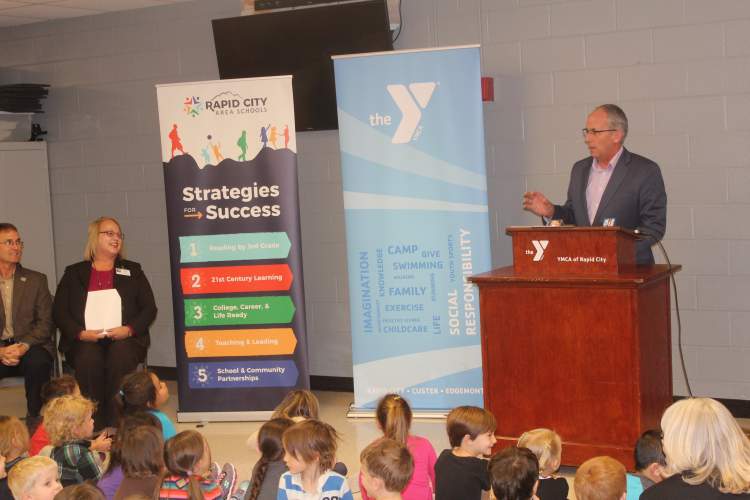 Rapid City Mayor Steve Allender joins YMCA, Rapid City Schools and Black Hills Energy officials in Tuesday's announcement regarding future plans for the YMCA, Black Hills Corporation Building and the City/School Administration Center.
