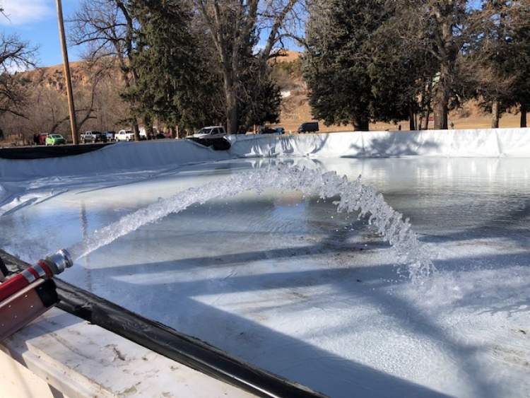 Water from Rapid Creek is being pumped into the renovated Braeburn Park Ice Rink.