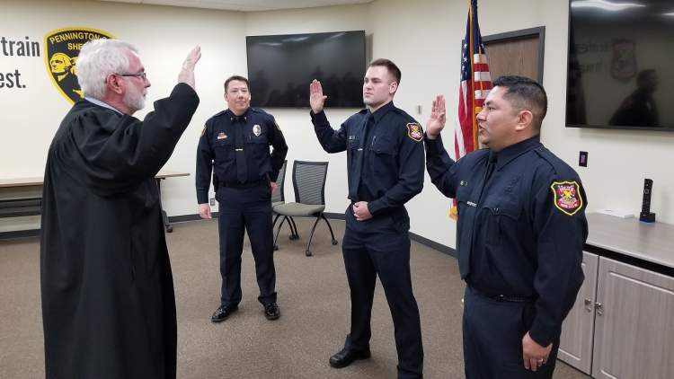 Officer Delfs (left) and Officer Romero (right) are sworn in as officers of the RCPD
