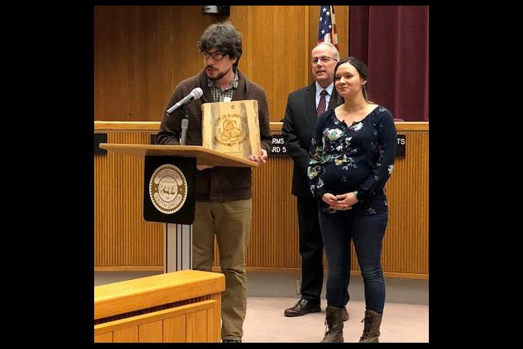 Jeffrey Thouron and Courtney Fischer of Breadroot Natural Foods Co-Op receive the Rapid City Sustainability Award.  Mayor Steve Allender presided over the recognition which was presented by members of the City's Sustainability Committee.
