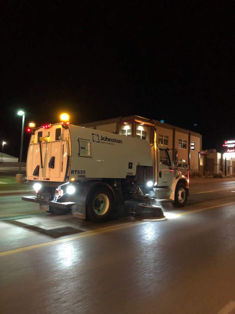 A City Street Sweeper works late at night along West Main Street.
