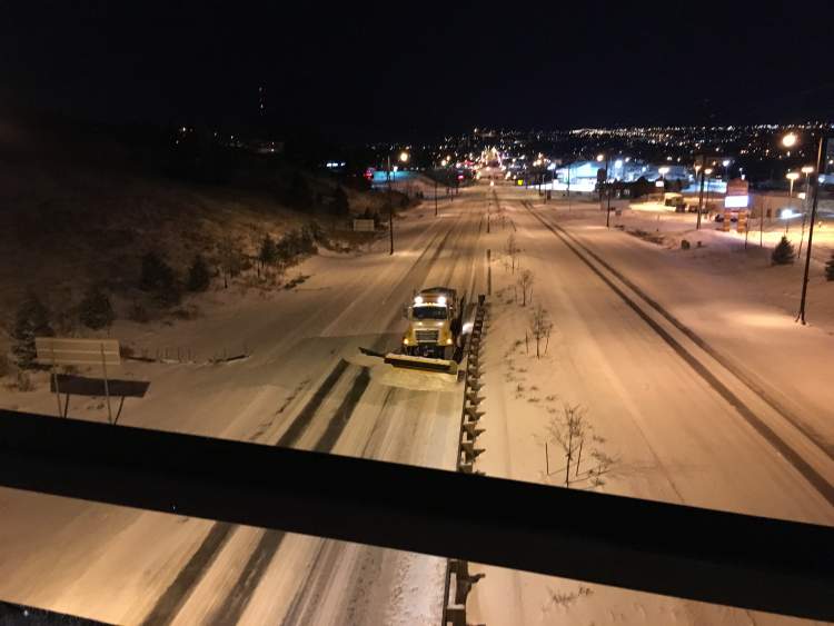 A City snow plow on Mount Rushmore Road near Tower Road.