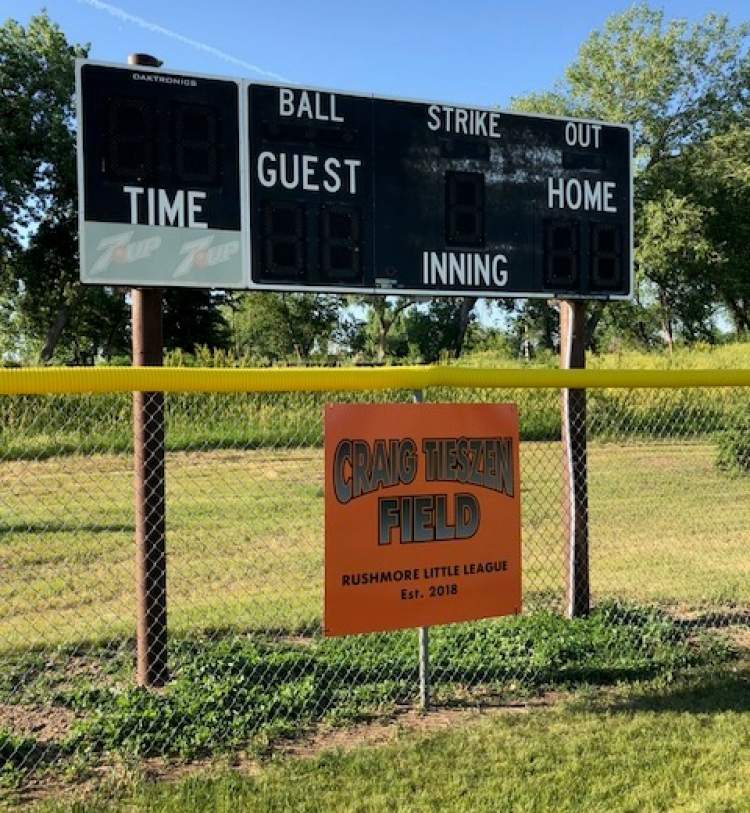 City and Rushmore Little League officials joined family and friends of the late Craig Tieszen to rename the Rushmore Minors Field as Craig Tieszen Field in field ceremonies June 13.