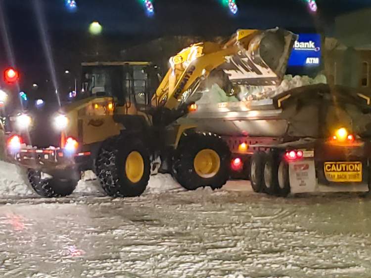 In this file photo from December 2, contractors and City crews were busy downtown collecting and hauling away snow during a downtown snow alert. The City has declared a Downtown Snow Alert for tonight/Wednesday morning from 2 a.m.-8 a.m. and cars must be removed from the downtown core area or car owners face towing charges and a fine.