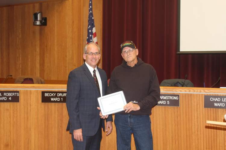 Mayor Steve Allender and the Rapid City Council honored Alan Kruse (right) as November's Veteran of the Month. 