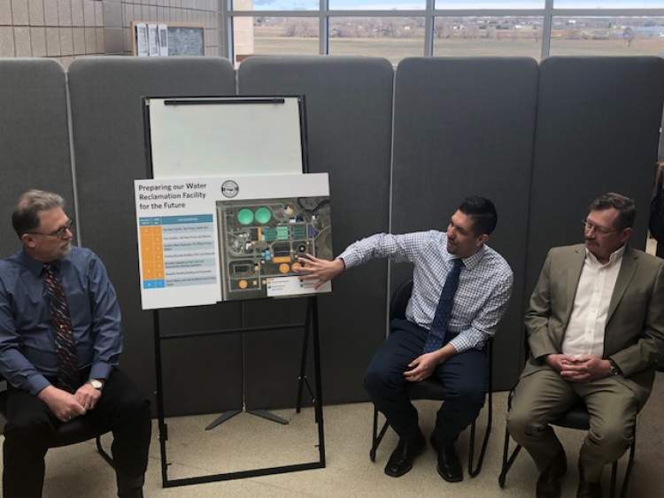 From left, Stacey Titus, Eddie Lopez and Dave Van Cleave of the City's Public Works Department discuss the state loan and grant awards to the City of Rapid City for the building of a new wastewater reclamation facility.