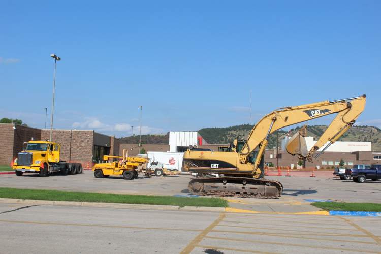 Construction crews have initiated work on parking lot improvements on the west side of the Rushmore Plaza Civic Center.