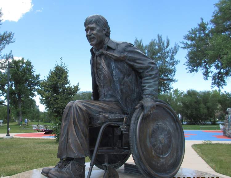 A statue of the late Scotty Backens, long-time member of the Mayor's Committee for People With Disabilities and a tireless advocate for the ADA and breaking down barriers impacting people with disabilities, is on display in Memorial Park.