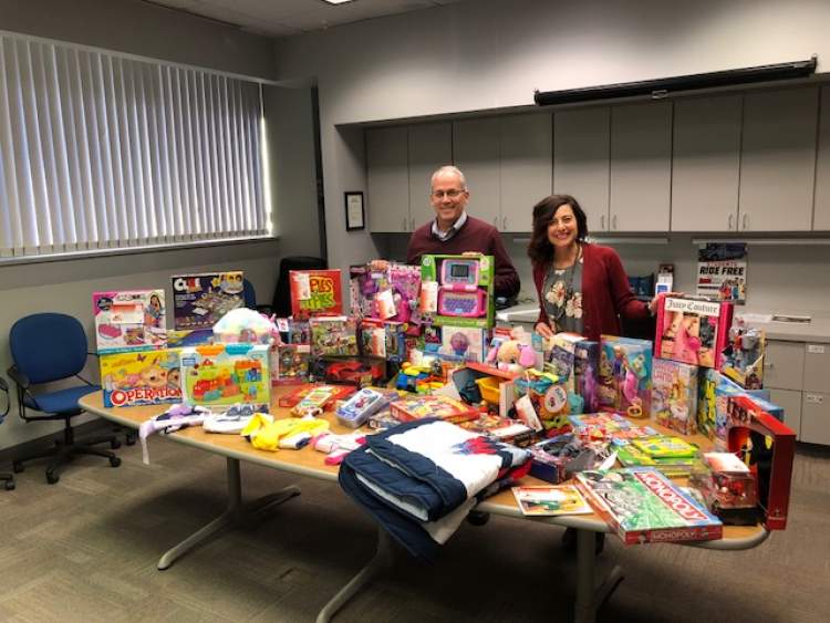 Mayor Steve Allender and Council member Laura Armstrong review just some of the Angel Tree gifts provided this season.