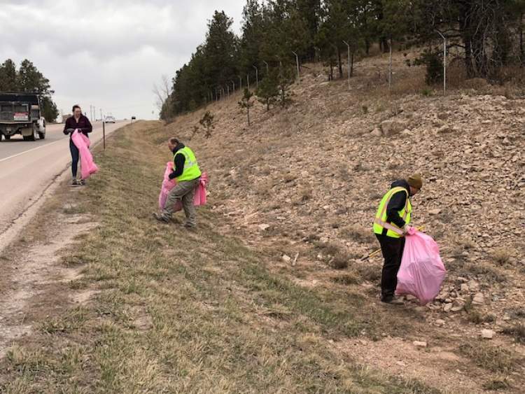 Members of the City's Public Works Department clean up litter and trash along Sturgis Road during 2023 Cleanup Week activities.