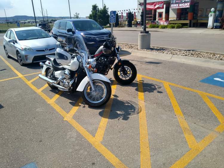 City Committee Reminds Motorcyclists, Drivers Not to Park in Striped Disability Access Spaces